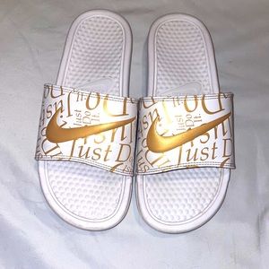 Women’s gold/rose gold Nike slides